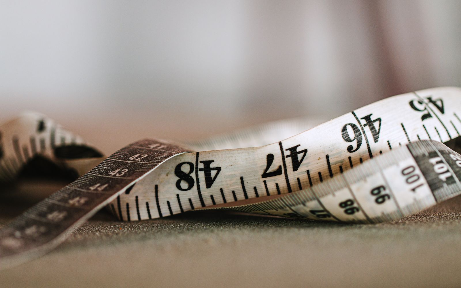 Close-up of a measuring tape showing inches and centimeters